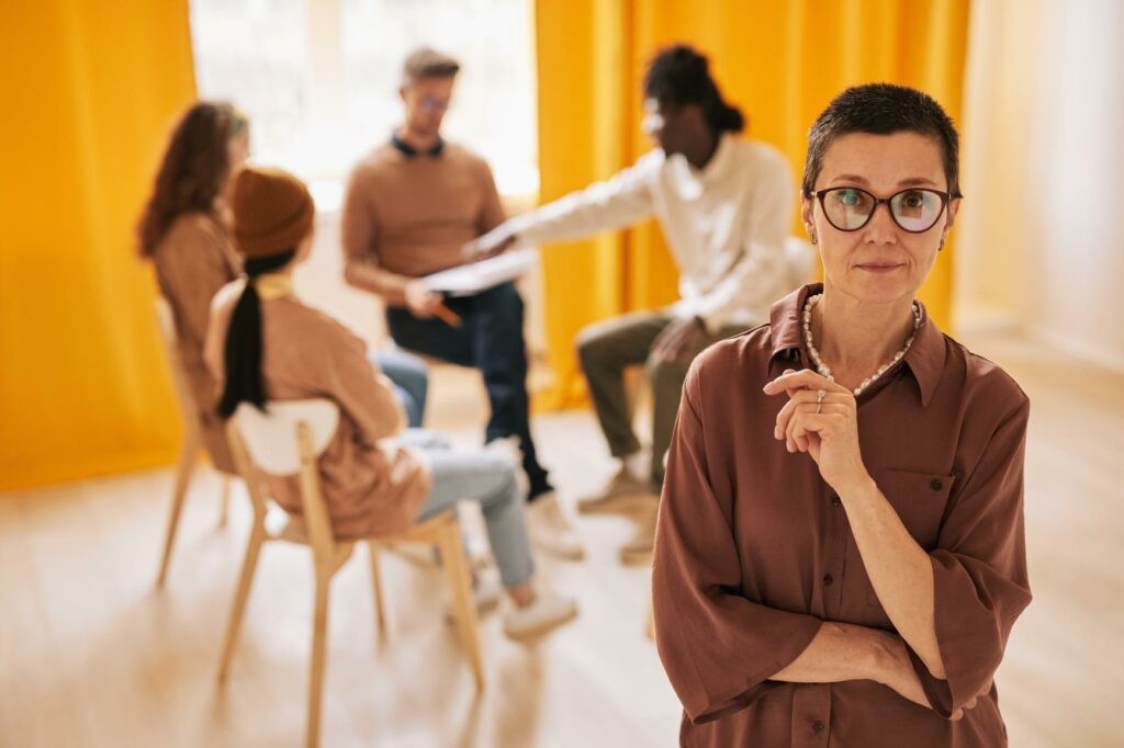 Psychologist Leading Group Therapy Session